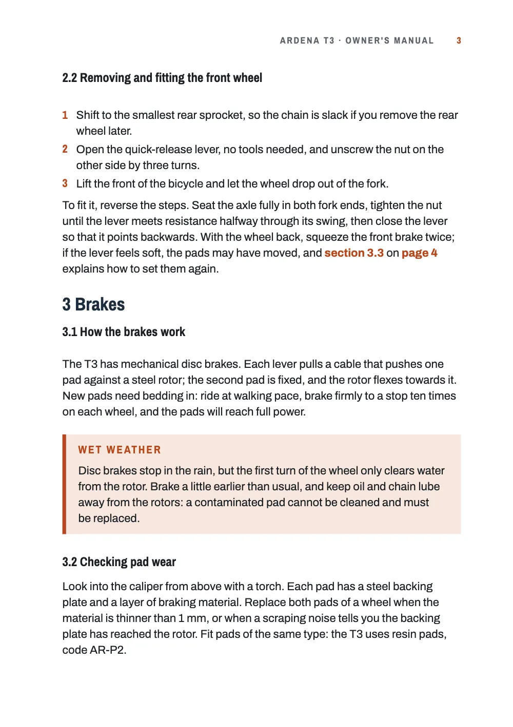 Page 3: 2.2 Removing and fitting the front wheel. Page 3: removing and fitting the front wheel, section 3 on the brakes with a Wet weather box with an orange side stripe, and the start of 3.2.